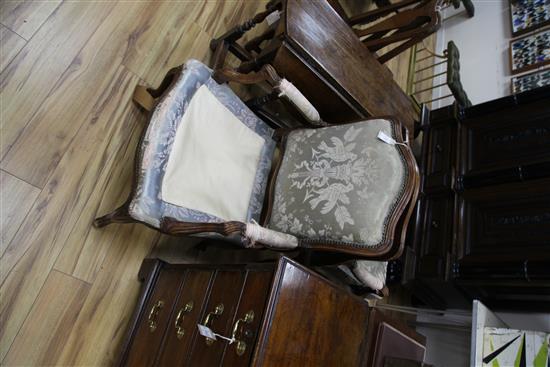A pair of Louis XV provincial French beech framed fauteuils,
